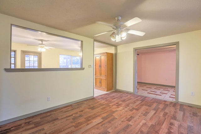 interior space with light hardwood / wood-style flooring and ceiling fan