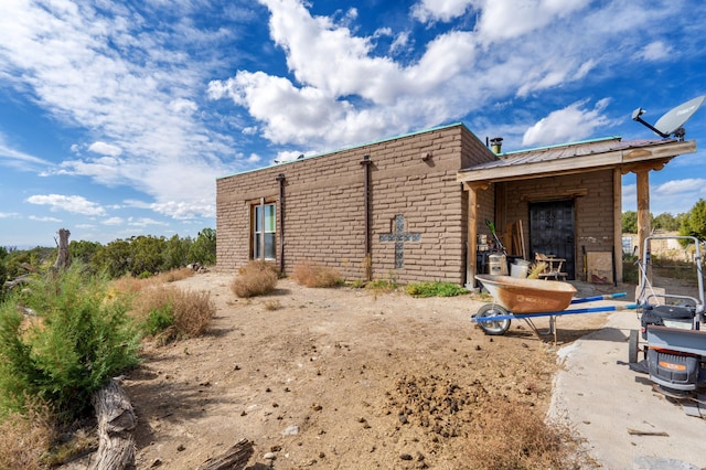 back of house with a patio