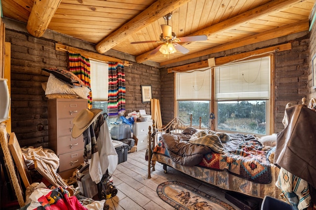 bedroom with wooden ceiling, light hardwood / wood-style flooring, ceiling fan, rustic walls, and beam ceiling