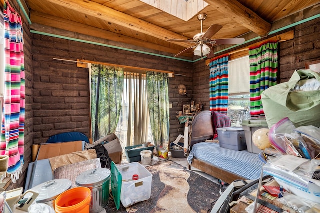 bedroom featuring a skylight, beamed ceiling, and wood ceiling