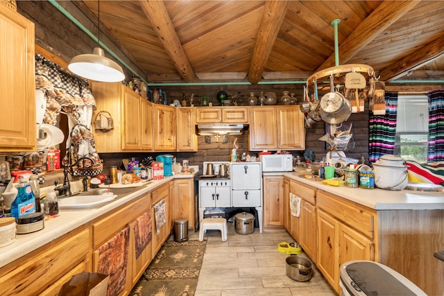 kitchen featuring lofted ceiling with beams, wooden ceiling, pendant lighting, and light hardwood / wood-style floors