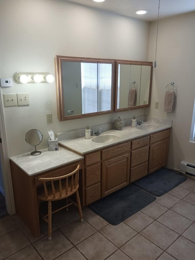 bathroom featuring tile patterned flooring and vanity