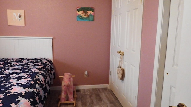 bedroom featuring dark hardwood / wood-style floors