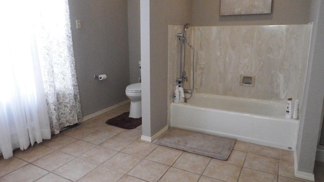 bathroom with tile patterned floors and toilet