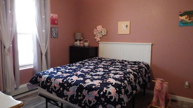 bedroom featuring hardwood / wood-style flooring