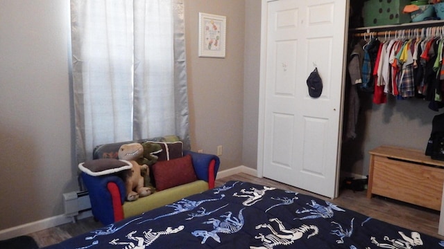 bedroom featuring hardwood / wood-style flooring and a closet