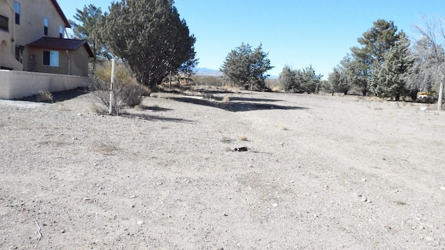 view of yard with a rural view