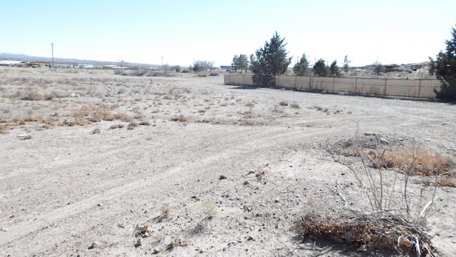 view of yard with a rural view