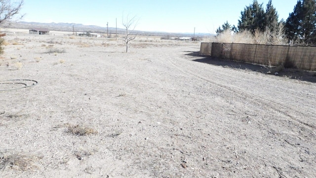 view of yard with a rural view