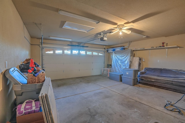 garage featuring a garage door opener and ceiling fan