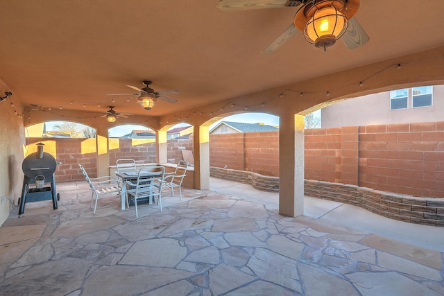 view of patio featuring ceiling fan and a grill