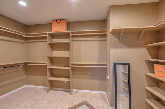 spacious closet with tile patterned flooring