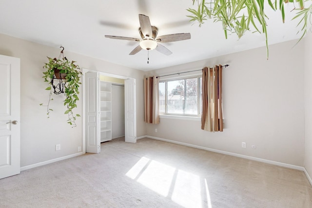 6311 Driscoll Ave NE, Albuquerque, NM 87109 - unfurnished bedroom with carpet floors, baseboards, and a ceiling fan
