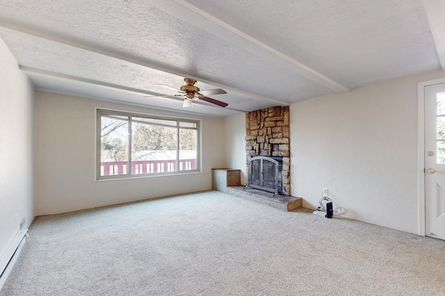 unfurnished living room featuring ceiling fan, a baseboard radiator, a stone fireplace, a textured ceiling, and carpet