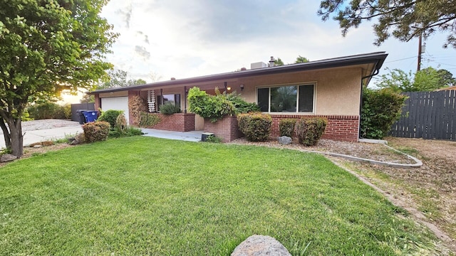 6311 Driscoll Ave NE, Albuquerque, NM 87109 - single story home featuring brick siding, a garage, and stucco siding
