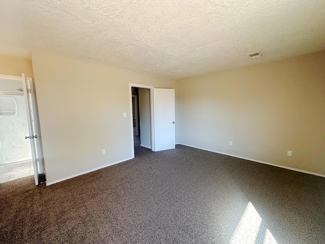 unfurnished bedroom featuring a textured ceiling