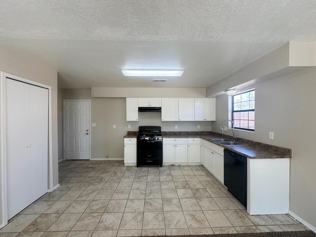 kitchen with black appliances, white cabinetry, sink, and a textured ceiling