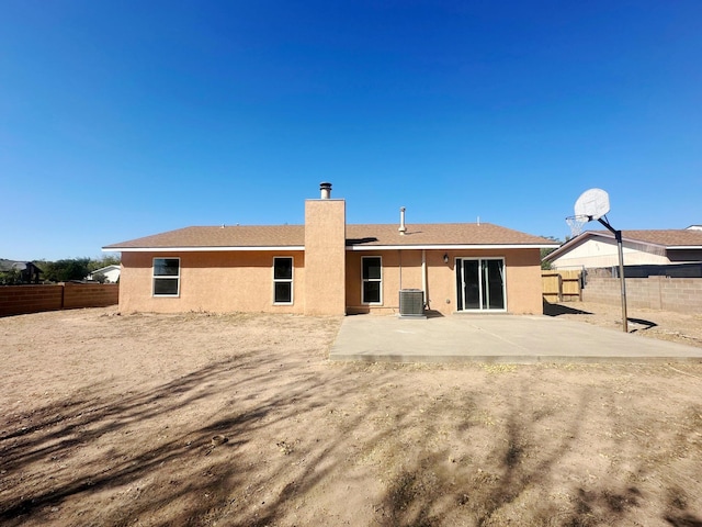 back of house featuring central AC unit and a patio area