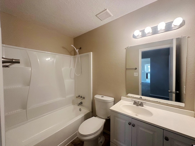 full bathroom with shower / tub combination, vanity, a textured ceiling, and toilet