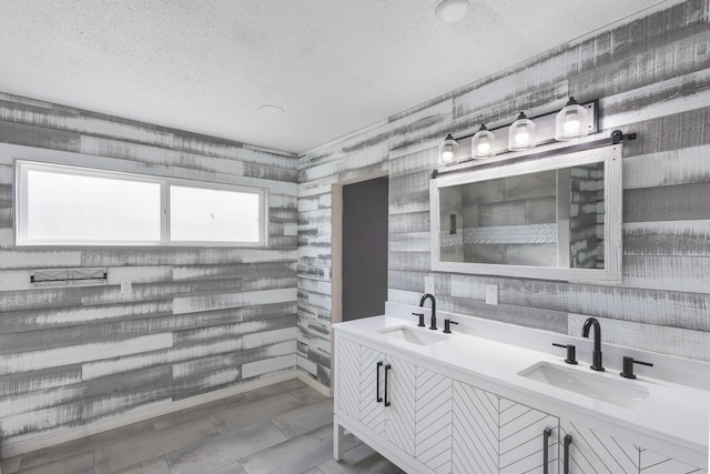 bathroom with vanity and a textured ceiling