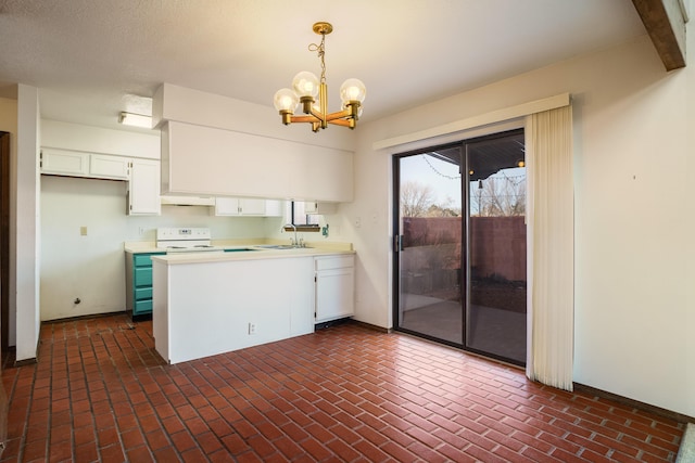 kitchen with white cabinetry, sink, hanging light fixtures, electric stove, and custom range hood