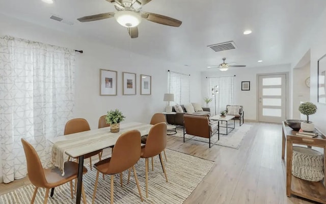 dining room featuring ceiling fan and light wood-type flooring