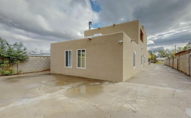 view of side of property featuring a patio