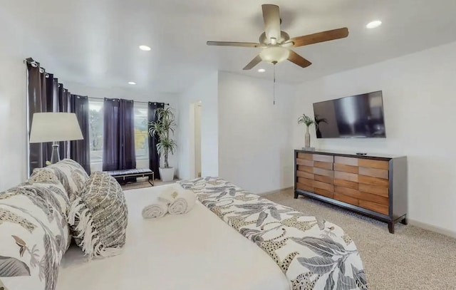 bedroom featuring ceiling fan and light colored carpet