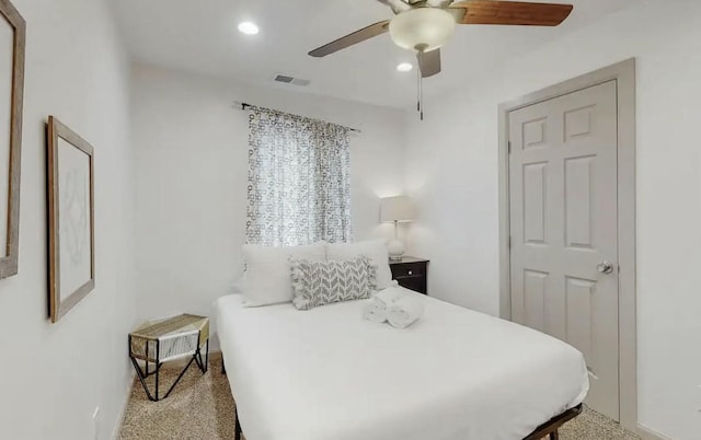 carpeted bedroom with ceiling fan