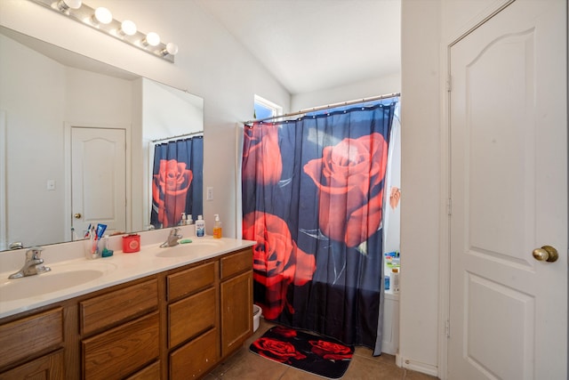 full bath with tile patterned flooring, a sink, and double vanity