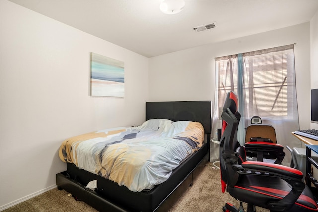 carpeted bedroom featuring visible vents and baseboards