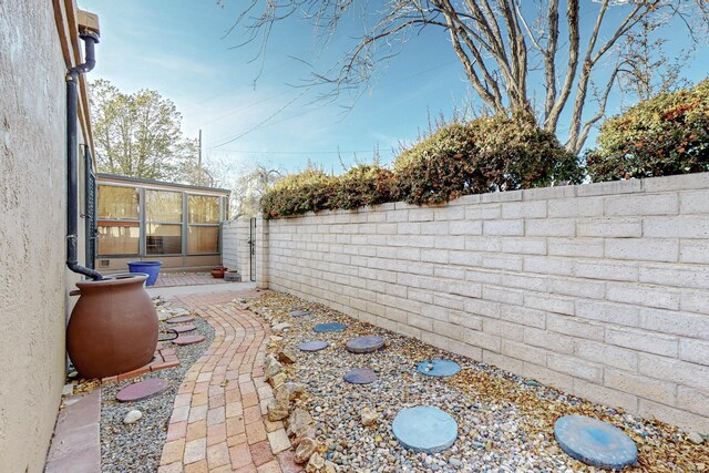 view of yard featuring a sunroom