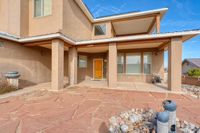 back of house with a patio