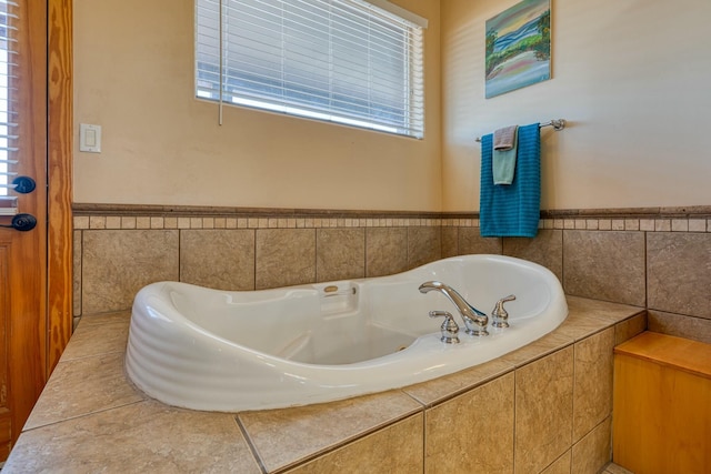 bathroom featuring a relaxing tiled tub