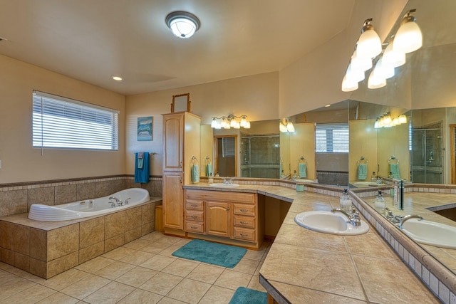 bathroom featuring separate shower and tub, tile patterned flooring, and vanity