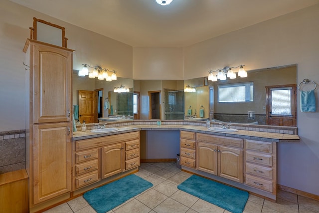 bathroom featuring tile patterned flooring and vanity