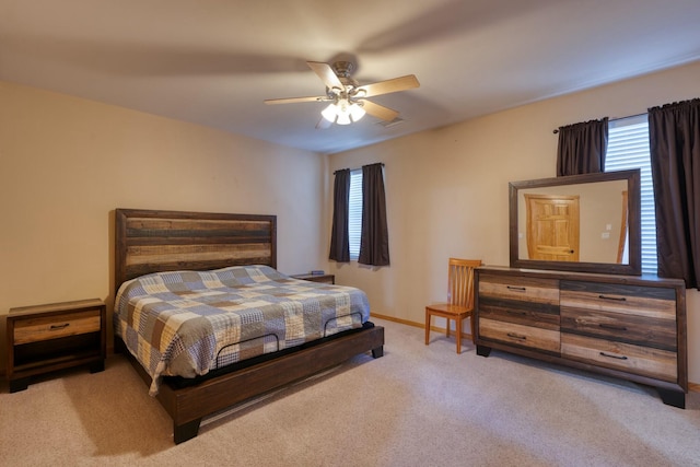 bedroom with ceiling fan and light colored carpet