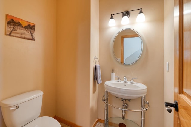 bathroom with toilet and sink