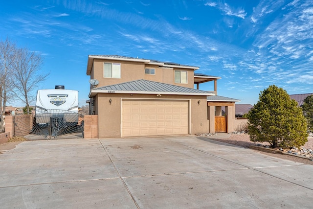 view of front property with solar panels and a garage