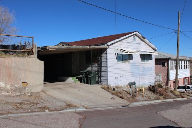407 E Maloney Ave, Gallup, NM 87301 - view of property exterior featuring an attached carport