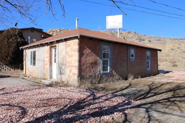 exterior space featuring stone siding