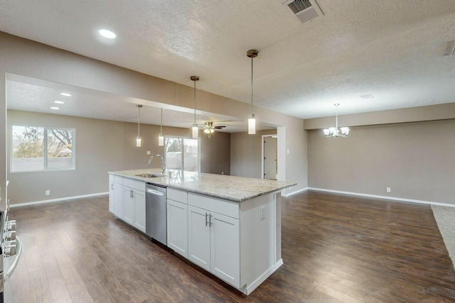 kitchen featuring white cabinets, decorative light fixtures, stainless steel dishwasher, and sink