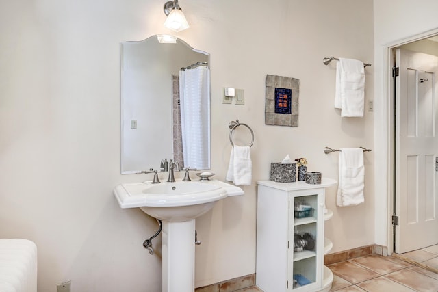 bathroom with tile patterned flooring and sink