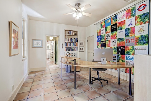 office space with ceiling fan, radiator heating unit, built in features, and tile patterned flooring