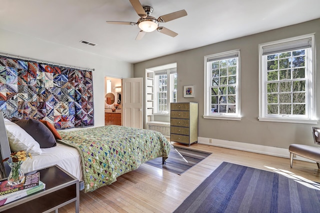 bedroom featuring ceiling fan and wood-type flooring