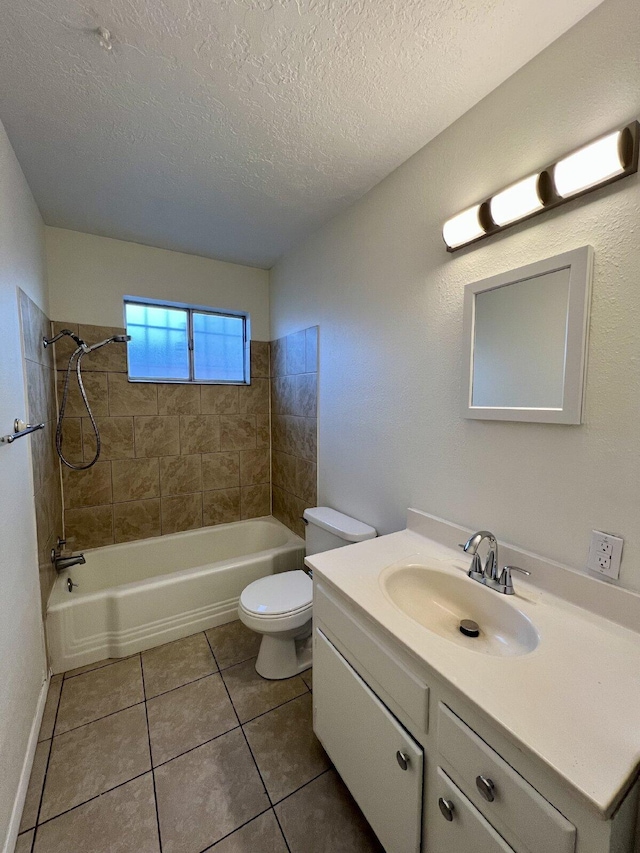 full bathroom with tile patterned flooring, a textured ceiling, toilet, vanity, and tiled shower / bath