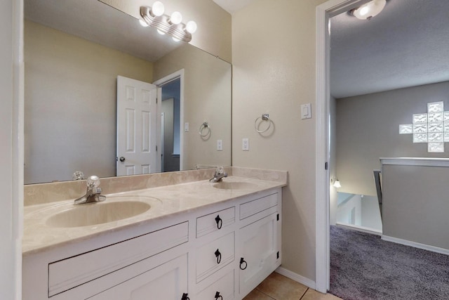 bathroom with tile patterned floors and vanity