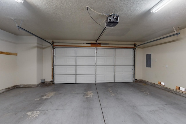 garage featuring a garage door opener and electric panel