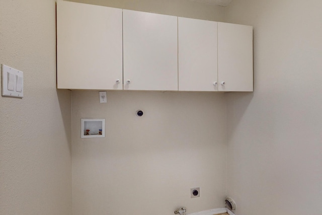 laundry room with electric dryer hookup, gas dryer hookup, cabinets, and washer hookup