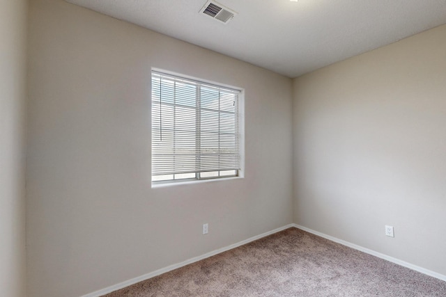 empty room featuring light colored carpet